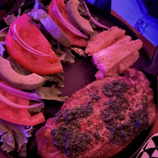 a plate of meat and vegetables