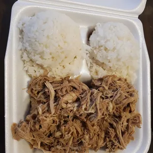 pulled pork and rice in a styrofoam container