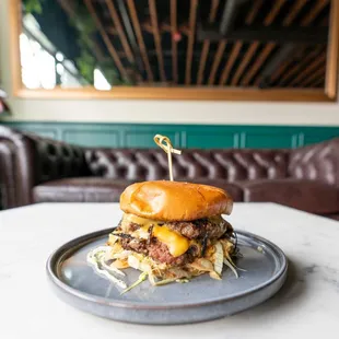 a burger on a plate on a table