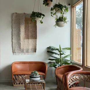 a living room with two chairs and a table