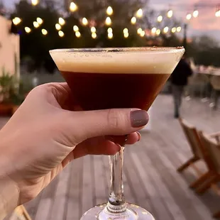 a person holding a glass of wine