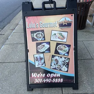 a sign on the sidewalk