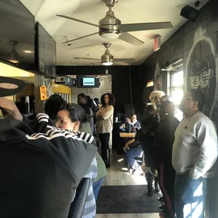 a crowd of people standing in line