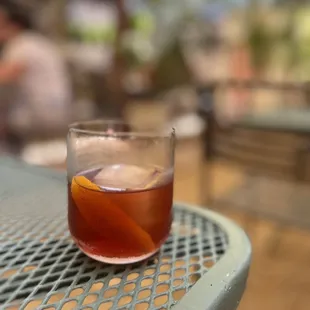 a glass of wine on a table