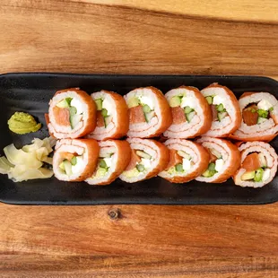 a plate of sushi rolls