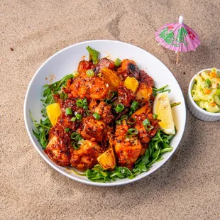 a bowl of food on the beach