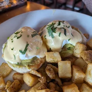 Eggs Benedict with an avocado mousse on a biscuit (no meat)