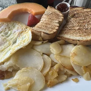 Eggs over easy, toast, breakfast potatoes
