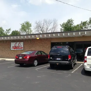 two cars parked in a parking lot