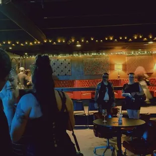 a group of people in a dimly lit room