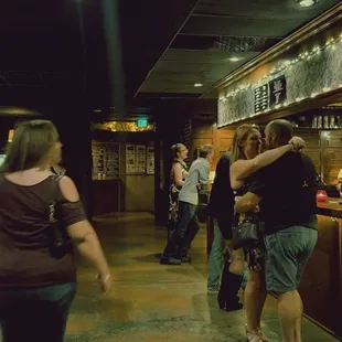 a group of people at a bar