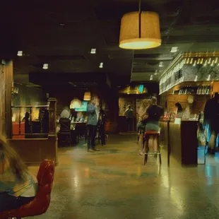 people sitting at tables in a restaurant