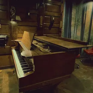 a piano in a recording studio