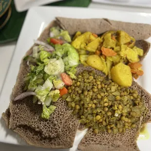 Lentils curry potatoes with salad and Gluten Free Injera. Yummmm!