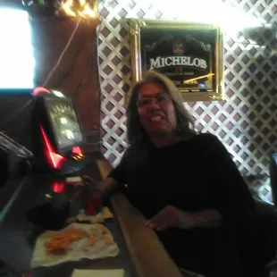 a woman sitting at a bar