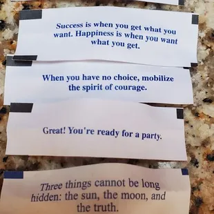 four pieces of toilet paper on a counter