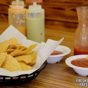 a basket of chips and salsa