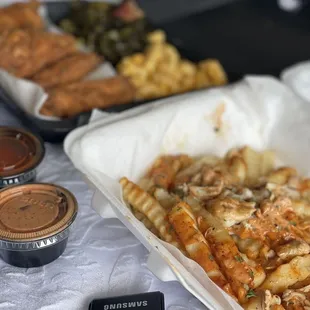 Chicken wingette platter , crab fries , hot sauce , Cajun sauce