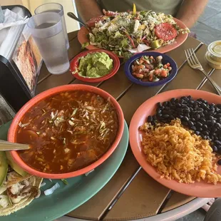 Fish taco, red pozole, LuLu's chopped salad with Pilla Asado + black beans, kids plate of beans and rice!