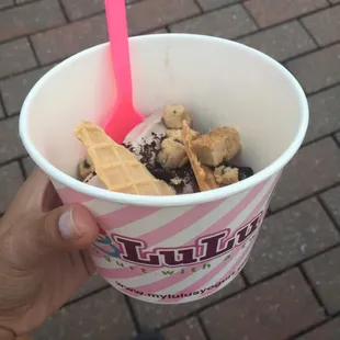Cookies and cream froyo with waffle cone, cookie dough, cheesecake, and Oreos