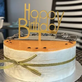 6" half passion fruit, half black sesame mille crepe cake with happy birthday sign (additional fee)