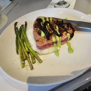 a plate of food with asparagus