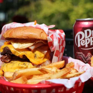 a basket of fries and a can of pepsi