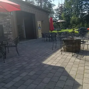 Outside seating with bar garage doors open.
