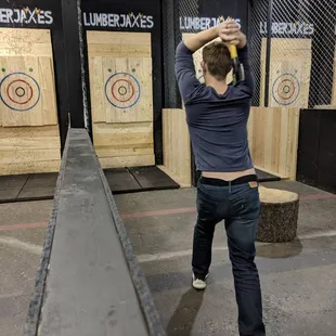 My husband throwing axes in his lane.