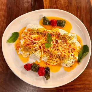 Beyti Sarma 

Adana kebab wrapped in lavash
Yogurt
Butter Sauce