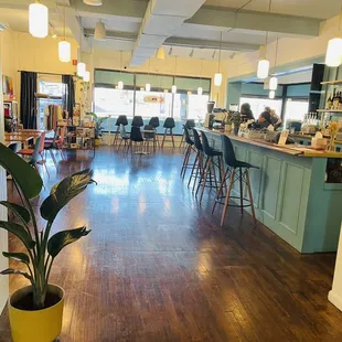 a restaurant with wood floors