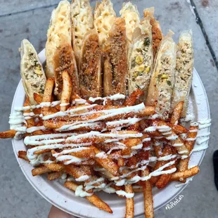 Mac and cheese, pork, and chicken poblano lumpia. Served with fries.
