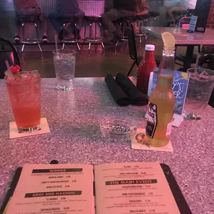 a menu and a drink