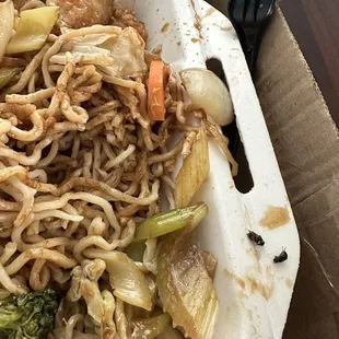 a plate of noodles and vegetables