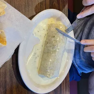 a person eating a burrito