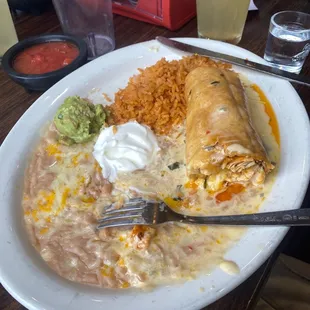 Chicken chimichanga with beans and rice.