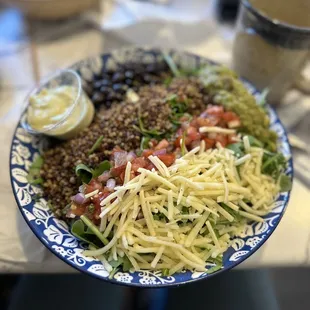 a blue and white plate of food