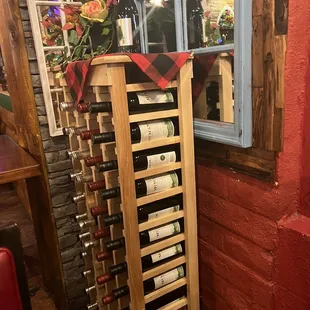 a wine rack with bottles of wine
