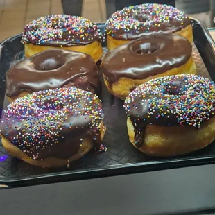 chocolate frosted donuts with sprinkles