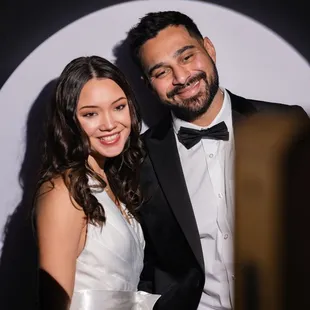 Step into the spotlight like this stunning couple! Make your big day unforgettable with our Spotlight Booth Experience. #SpotlightBooth