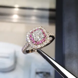 Princess cut diamond in Double Halo of White and Pink Diamonds set in Rose Gold.