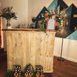 a bar decorated with candles and flowers