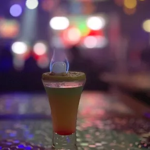 a shot of a cocktail on a bar