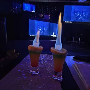 two cocktails on a bar