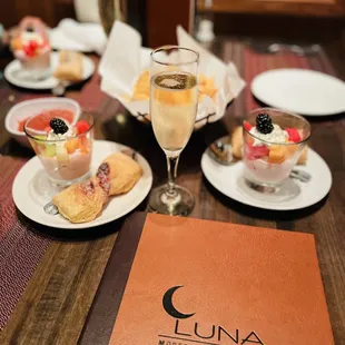 Champagne brunch with yogurt, fruits, and fresh baked sweet bread