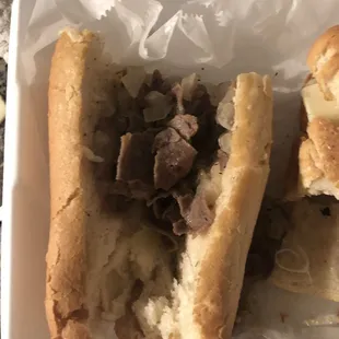 This is one half of the cheesesteak after I cut the end of the roll open... and I ordered extra meat.