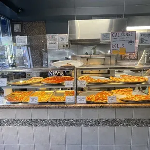 a display of pizzas in a restaurant
