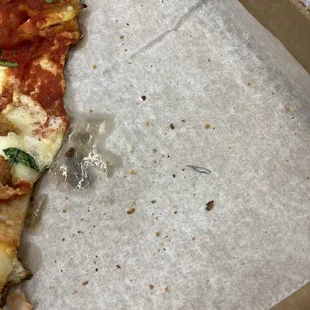 There is sharp metal object inside the pizza. It could almost kill me.