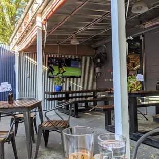 Outside on the patio. Part of the patio is covered and has a TV. They were playing NFL Red Zone during our visit today. Lots of heat lamps.