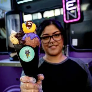 a woman holding an ice cream cone